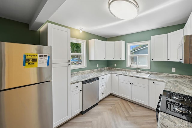 1516 Gainey Ave, Flint, MI 48503 - kitchen featuring stainless steel appliances and white cabinetry