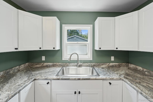 1516 Gainey Ave, Flint, MI 48503 - kitchen with white cabinets and light countertops