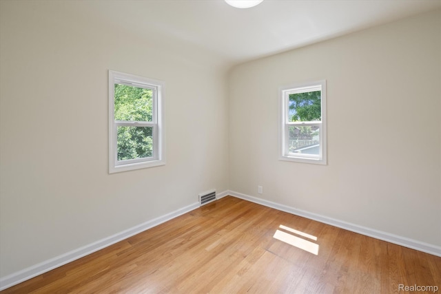 1516 Gainey Ave, Flint, MI 48503 - empty room with plenty of natural light and light wood-type flooring