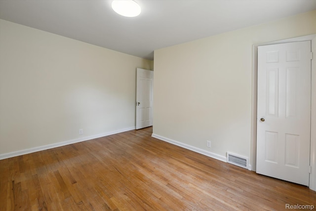 1516 Gainey Ave, Flint, MI 48503 - spare room with wood finished floors and baseboards