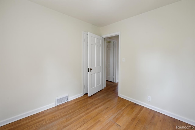 1516 Gainey Ave, Flint, MI 48503 - spare room with baseboards and light wood finished floors