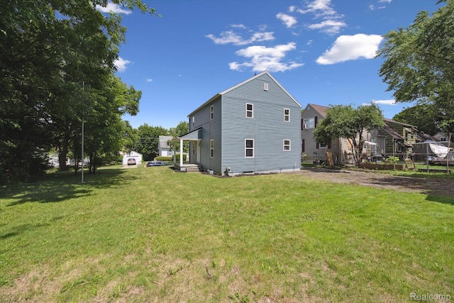 1516 Gainey Ave, Flint, MI 48503 - rear view of property featuring a lawn