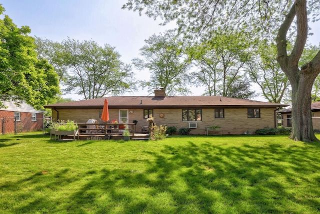 120 Sunburst Dr, Frankenmuth, MI 48734 - back of house with a chimney and a wooden deck