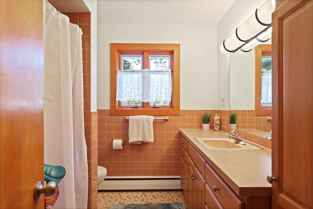 120 Sunburst Dr, Frankenmuth, MI 48734 - full bathroom featuring a baseboard heating unit, healthy amount of natural light, vanity, a wainscoted wall, and tile walls