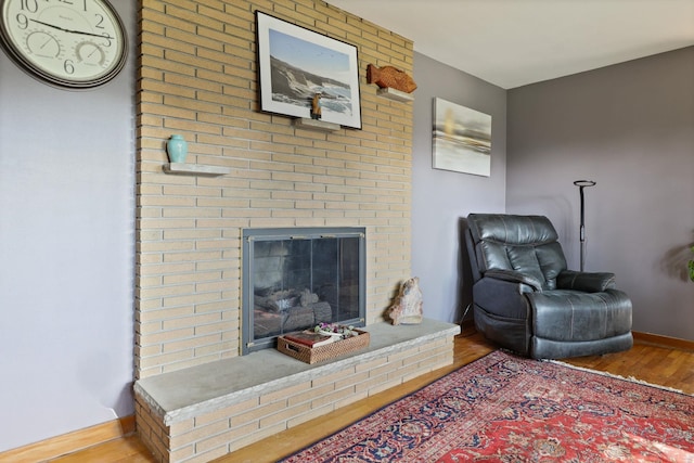 120 Sunburst Dr, Frankenmuth, MI 48734 - living area with wood finished floors and a brick fireplace