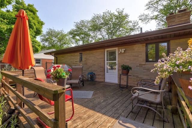 120 Sunburst Dr, Frankenmuth, MI 48734 - wooden deck featuring outdoor dining space