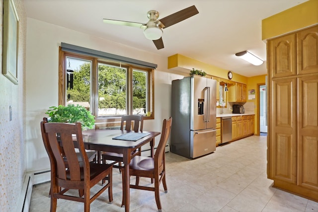 120 Sunburst Dr, Frankenmuth, MI 48734 - dining space featuring a ceiling fan, a baseboard heating unit, and light tile patterned floors