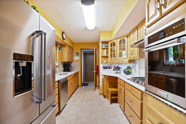 120 Sunburst Dr, Frankenmuth, MI 48734 - kitchen featuring stainless steel appliances, open shelves, light countertops, and decorative backsplash