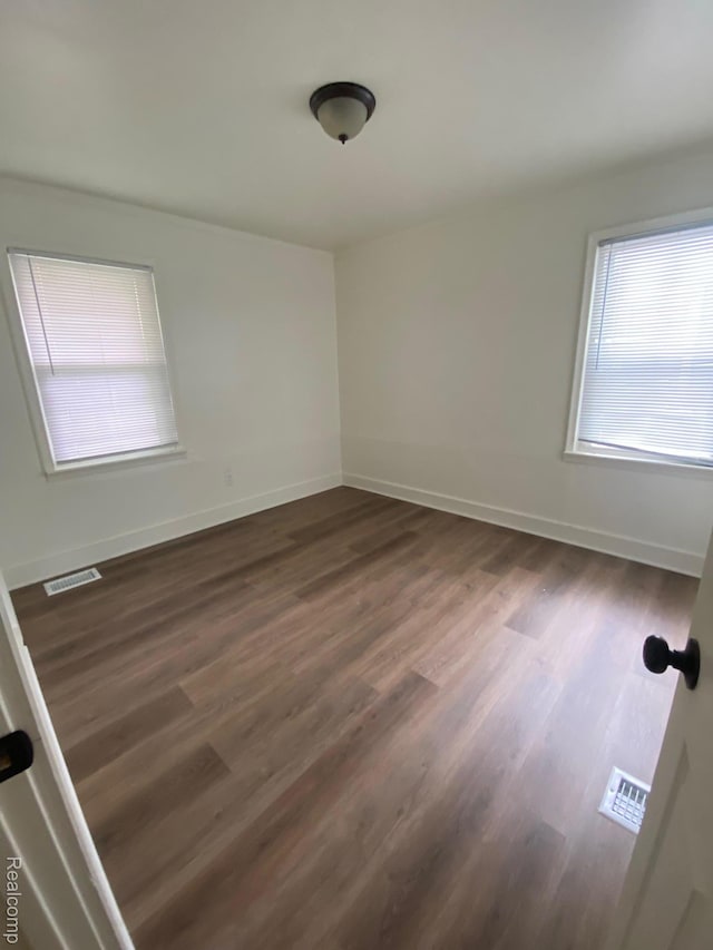 15354 Oldham St, Taylor, MI 48180 - spare room featuring dark wood-type flooring and baseboards