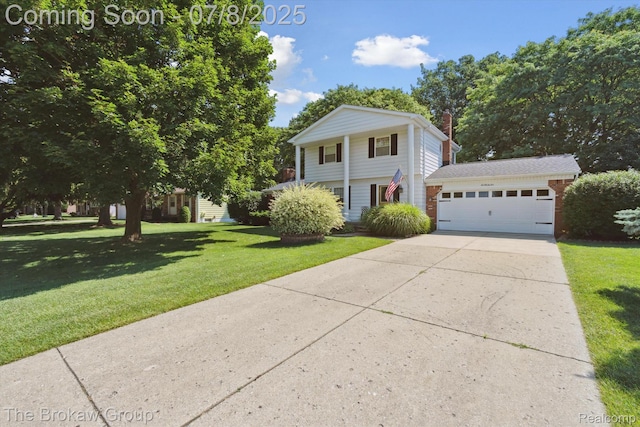 2210 Old Hickory Blvd, Davison, MI 48423 - view of front of house featuring an attached garage, a front yard, driveway, a chimney, and brick siding