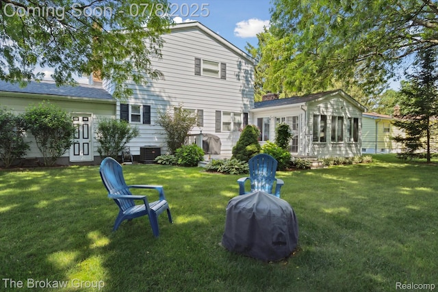 2210 Old Hickory Blvd, Davison, MI 48423 - back of property with a yard and a sunroom