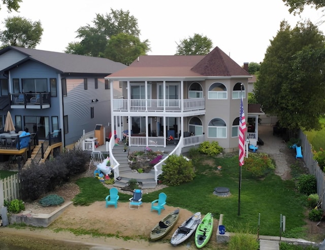 296 Lyon Lake Rd, Marshall, MI 49068 - rear view of property featuring stairway, a balcony, and covered porch