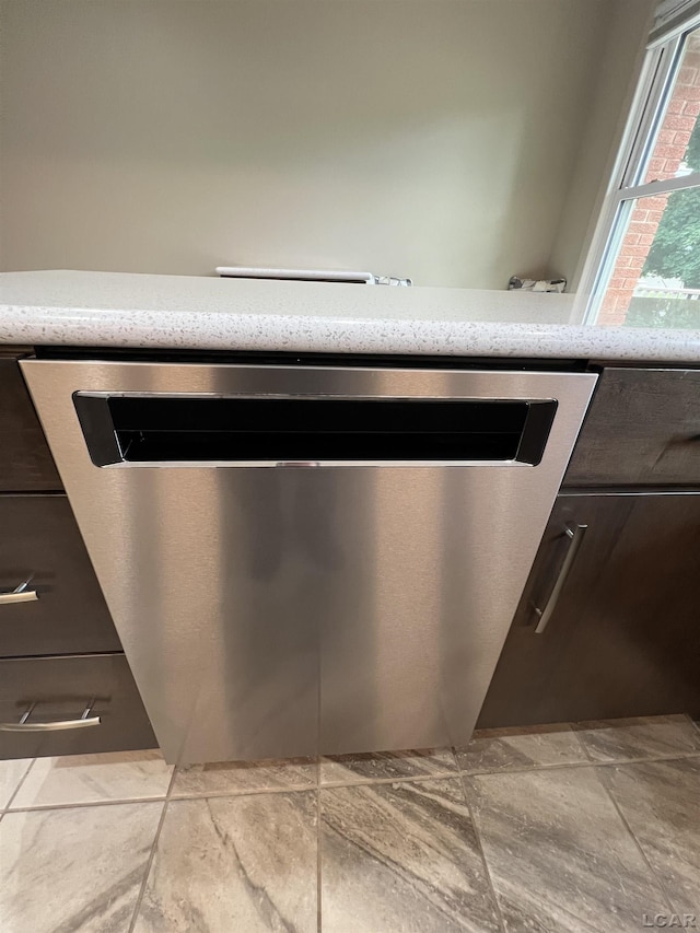 2244 Shannon Dr, Adrian, MI 49221 - kitchen view of dishwasher and dark brown cabinetry