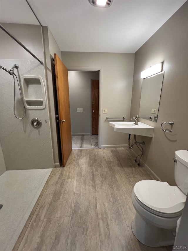 2244 Shannon Dr, Adrian, MI 49221 - bathroom featuring a shower stall and wood finished floors