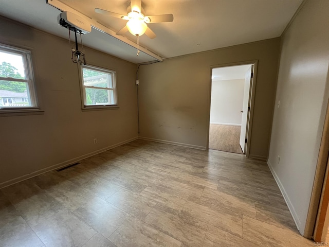 2244 Shannon Dr, Adrian, MI 49221 - spare room featuring a ceiling fan and baseboards