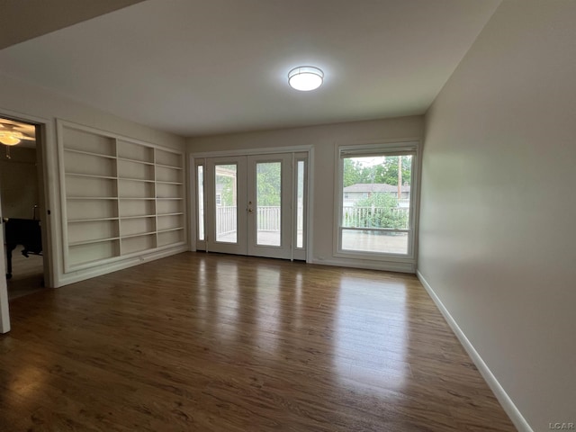 2244 Shannon Dr, Adrian, MI 49221 - spare room featuring french doors, wood finished floors, and built in features