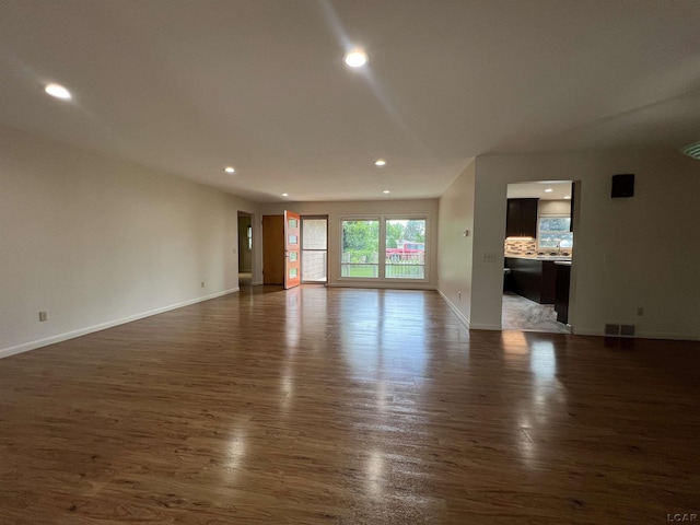 2244 Shannon Dr, Adrian, MI 49221 - unfurnished living room with dark wood finished floors and recessed lighting