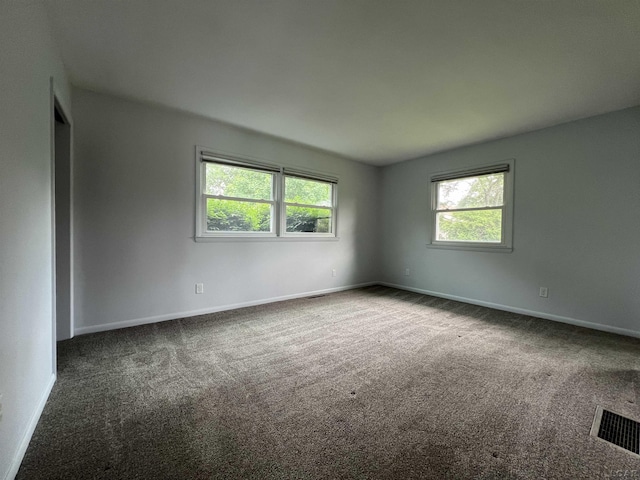 2244 Shannon Dr, Adrian, MI 49221 - empty room with dark carpet and baseboards
