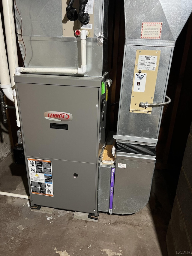 2244 Shannon Dr, Adrian, MI 49221 - utility room featuring heating unit