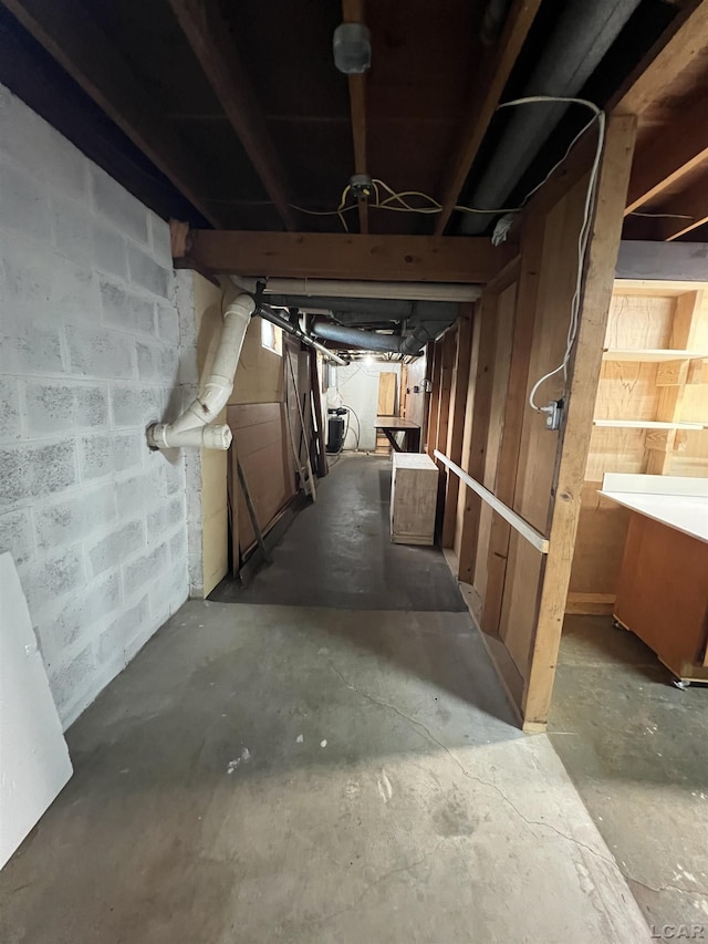 2244 Shannon Dr, Adrian, MI 49221 - corridor with unfinished concrete floors and concrete block wall