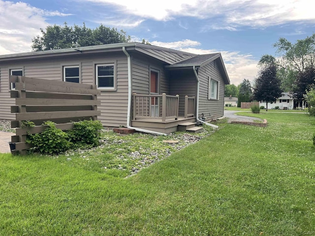 2244 Shannon Dr, Adrian, MI 49221 - view of side of home featuring a yard and a wooden deck
