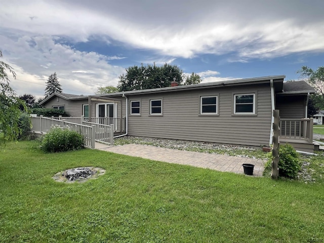 2244 Shannon Dr, Adrian, MI 49221 - back of house with a lawn and a wooden deck