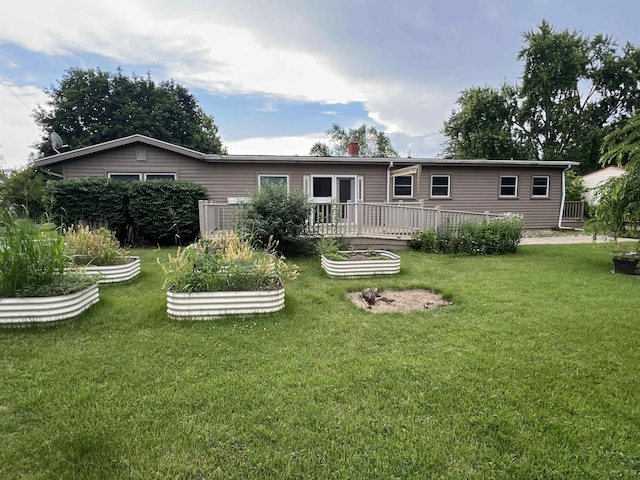 2244 Shannon Dr, Adrian, MI 49221 - rear view of property with a garden, a yard, and a chimney