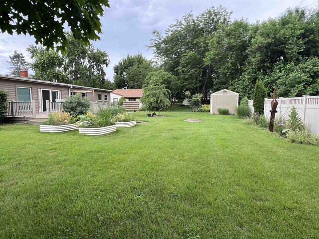 2244 Shannon Dr, Adrian, MI 49221 - view of yard with a shed and a vegetable garden