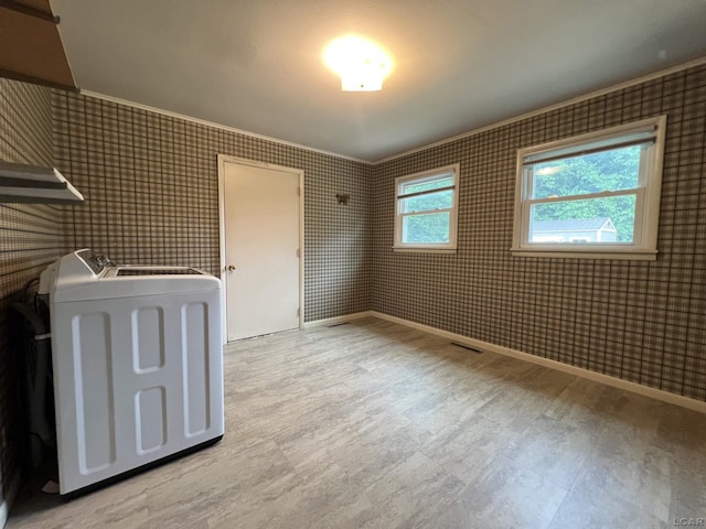 2244 Shannon Dr, Adrian, MI 49221 - unfurnished bedroom featuring washer / dryer and light wood-style floors