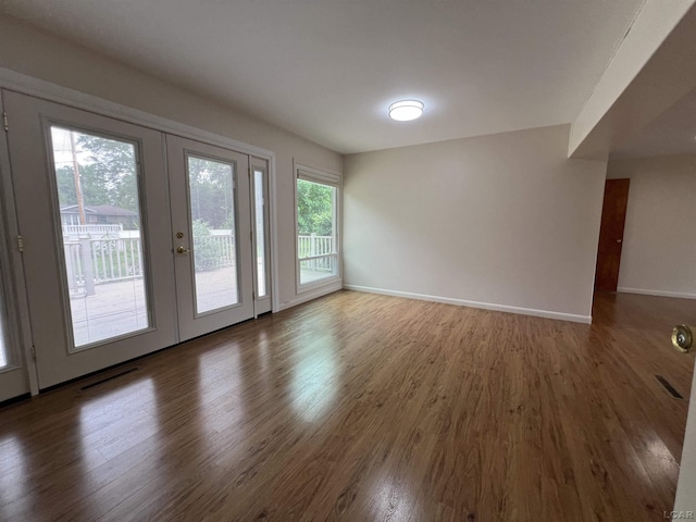 2244 Shannon Dr, Adrian, MI 49221 - spare room with french doors and wood finished floors