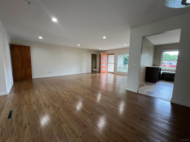 2244 Shannon Dr, Adrian, MI 49221 - unfurnished living room featuring light wood-type flooring, plenty of natural light, and recessed lighting
