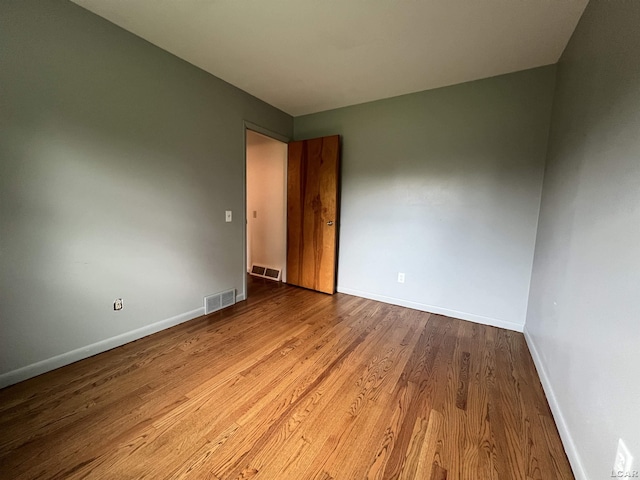 2244 Shannon Dr, Adrian, MI 49221 - spare room featuring baseboards and wood finished floors
