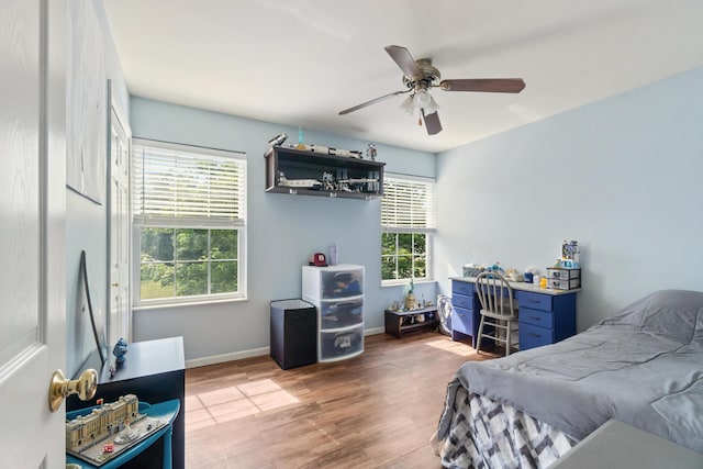 127 Ridgeview Ct, Grass Lake, MI 49240 - bedroom with wood finished floors and a ceiling fan