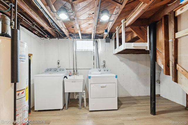 15101 Drake St, Southgate, MI 48195 - washroom with washing machine and dryer, gas water heater, and light wood-style floors