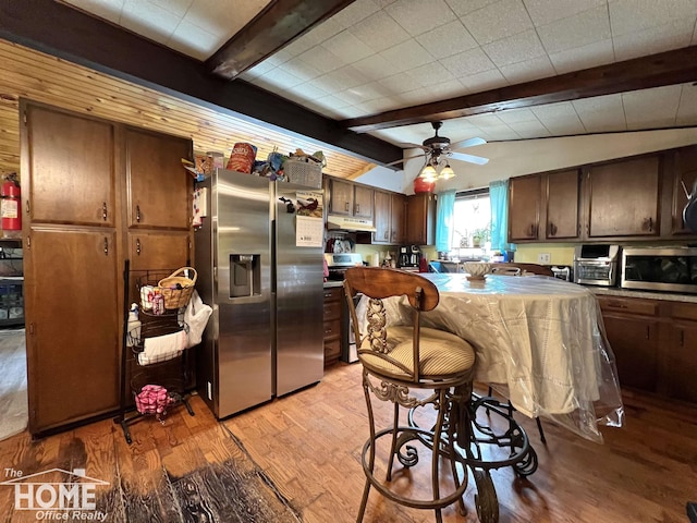 4949 S Iva Rd, Merrill, MI 48637 - kitchen featuring stainless steel appliances, light wood-style flooring, under cabinet range hood, ceiling fan, and dark brown cabinetry
