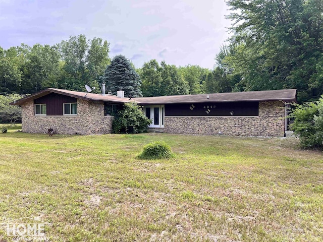 4949 S Iva Rd, Merrill, MI 48637 - view of front of property featuring a front yard and brick siding