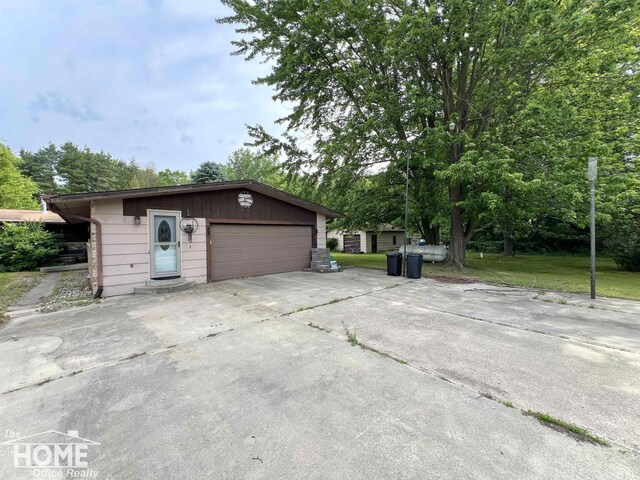 4949 S Iva Rd, Merrill, MI 48637 - garage featuring concrete driveway
