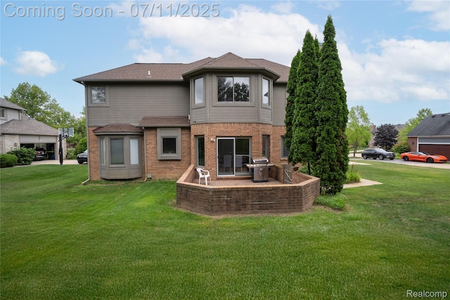 24145 Windridge Ln, Novi, MI 48374 - rear view of house with a lawn, brick siding, a patio, and a shingled roof