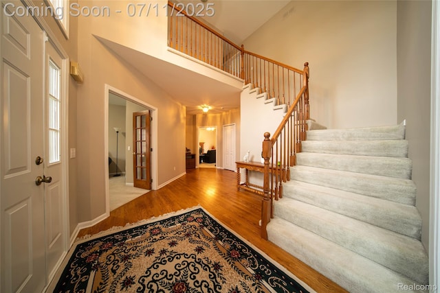 24145 Windridge Ln, Novi, MI 48374 - foyer featuring a high ceiling, wood finished floors, and stairs