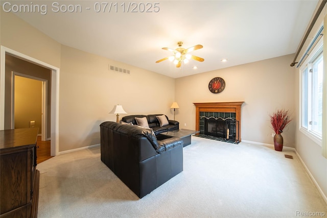 24145 Windridge Ln, Novi, MI 48374 - living room with light colored carpet, ceiling fan, and a fireplace