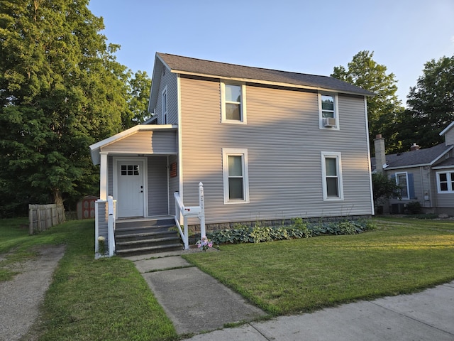 7 Hewitt St, Quincy, MI 49082 - view of front facade featuring a front lawn and cooling unit
