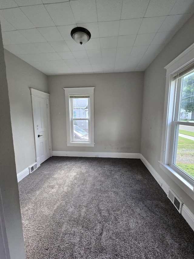 7 Hewitt St, Quincy, MI 49082 - spare room featuring dark carpet