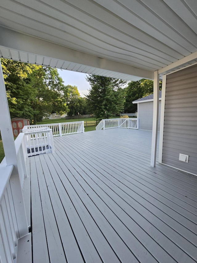 7 Hewitt St, Quincy, MI 49082 - wooden deck with a storage unit