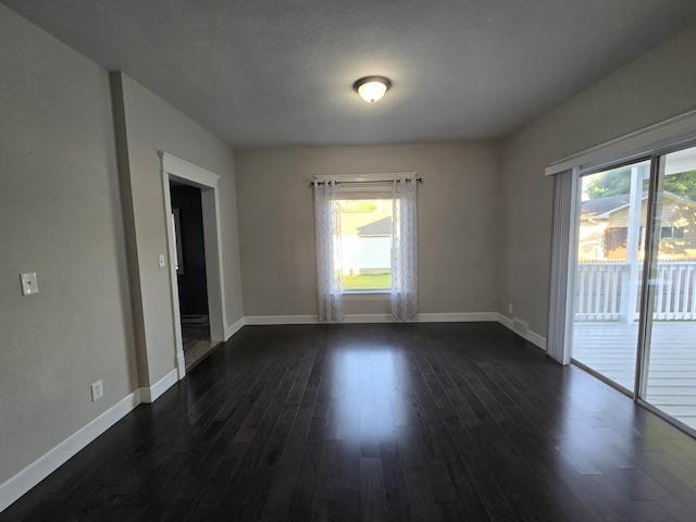 7 Hewitt St, Quincy, MI 49082 - unfurnished room with plenty of natural light and dark wood-style flooring