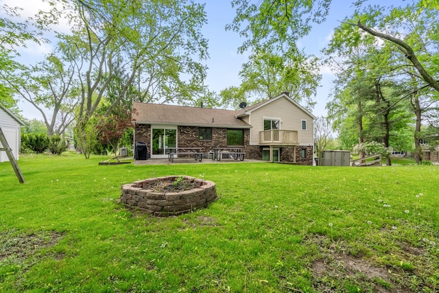 5304 Driftwood Ave, Kalamazoo, MI 49009 - back of property with a patio, a lawn, and brick siding