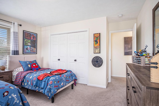 5665 Koster Dr SW, Wyoming, MI 49418 - bedroom featuring light carpet and a closet