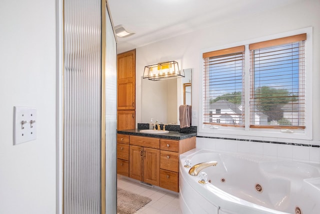 5665 Koster Dr SW, Wyoming, MI 49418 - full bath with vanity, a whirlpool tub, tile patterned floors, and a shower