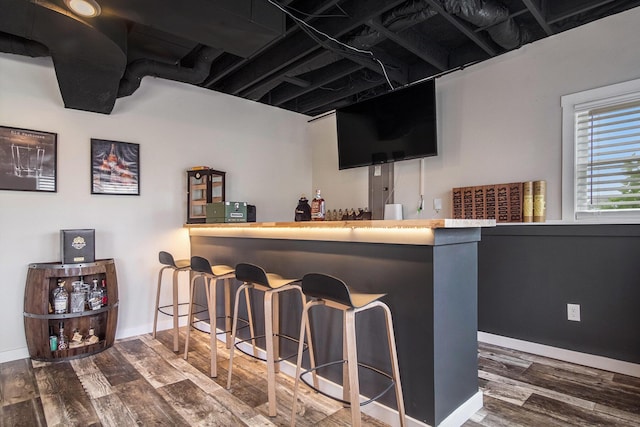5665 Koster Dr SW, Wyoming, MI 49418 - indoor bar with wood finished floors and baseboards