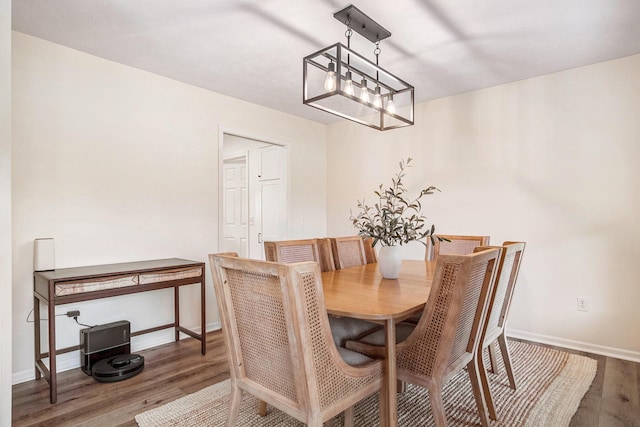 5665 Koster Dr SW, Wyoming, MI 49418 - dining space with wood finished floors and baseboards