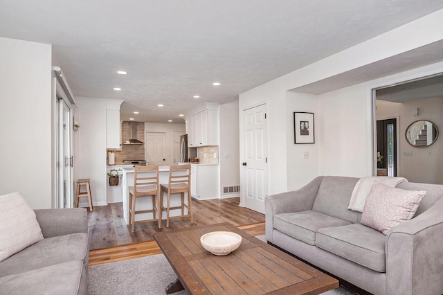 5665 Koster Dr SW, Wyoming, MI 49418 - living area featuring recessed lighting and light wood-type flooring